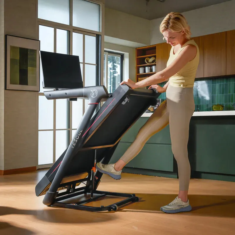 Woman folding the T3S Plus treadmill